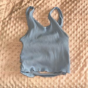 A blue medium crop top perfect for the beach and has a crisscross back.